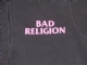 Zipped hoodie with pink Bad Religion text (womens) - Front Upclose (1000x750)